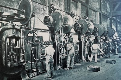 Production line workers processing cast metal components in the FIAT foundries