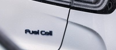 a modern car with a fuel cell sign