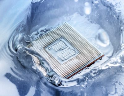technology cyber electronic concept. cpu ram computer Fall into the water on blue light background. CPU cooling with water