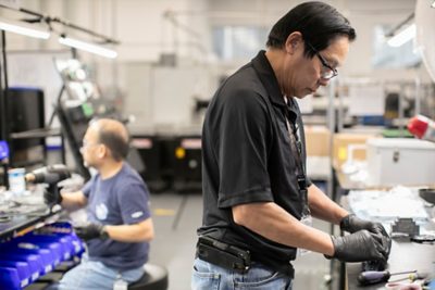 Dedicated professionals operating advanced machinery with skill and care.