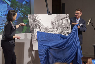 Franziska Eggimann, Head of Iron Library and Corporate Archivist, and Yves Serra opening a photography exhibition, which tells the history of GF at the Klostergut Paradies.