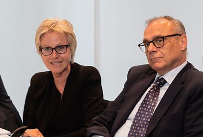 Eveline Saupper, Chairwoman of the Compensation Committee and Peter Ziswiler, Head Corporate HR, sitting at a boardroom table