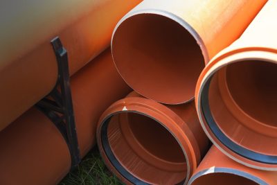 Plastic pipes for external sewerage, elements of a sewerage system. Close-up photo