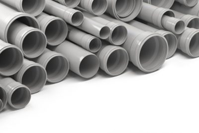 PVC plastic pipes and tubes stacked in warehouse. 3d illustration